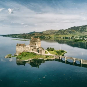 Castle on island connected by stone bridge